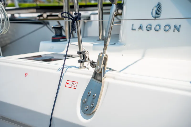 Slide: The Image of 2026 Lagoon 38 yacht deck detail with logo and rigging components. - 20