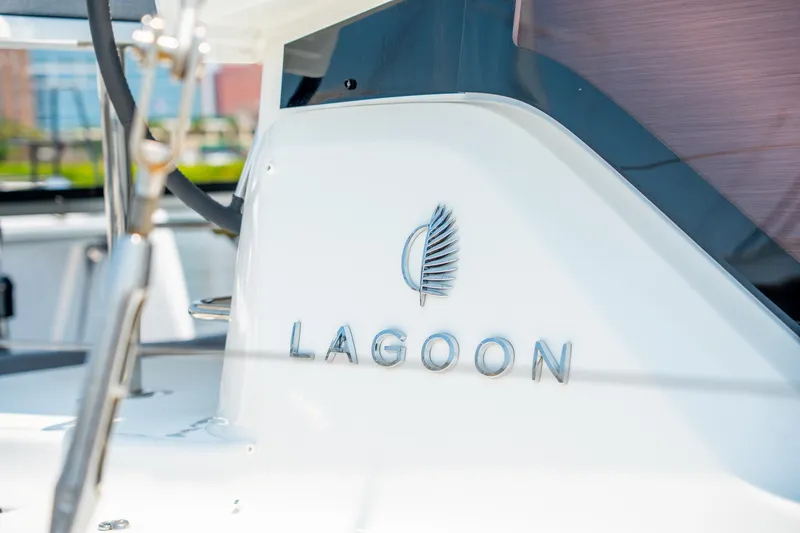 Slide: The Image of 2026 Lagoon 38 yacht logo on sleek white surface. - 19