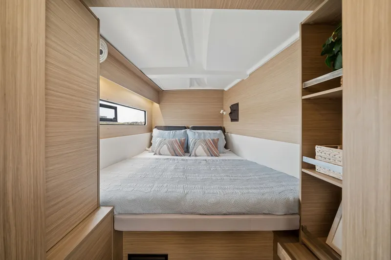Slide: The Image of Luxurious cabin interior of 2026 Lagoon 38 yacht, featuring a cozy bed and modern design. - 71