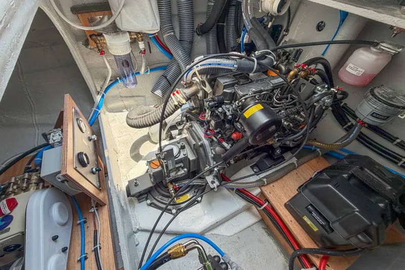 Slide: The Image of Engine compartment of a 2026 Lagoon 38 boat, showcasing detailed mechanical components. - 116