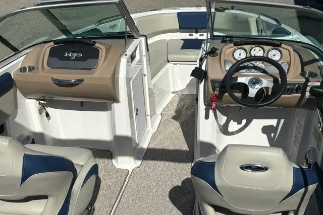 Slide: The Image of 2015 Chaparral 21 SSi Ski & Fish boat interior with steering wheel and seating. - 15