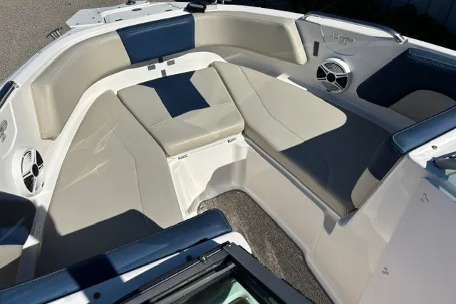 Slide: The Image of 2015 Chaparral 21 SSi Ski & Fish boat interior with cushioned seating and built-in speakers. - 14