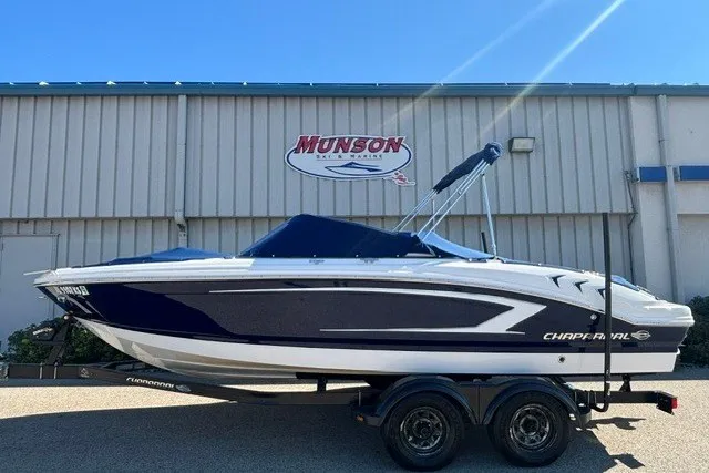 Slide: The Image of 2015 Chaparral 21 SSi Ski & Fish boat on trailer, parked outside Munson building. - 3