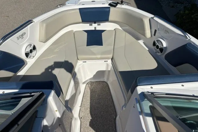 Slide: The Image of 2015 Chaparral 21 SSi Ski & Fish boat interior with cushioned seating and speakers. - 12