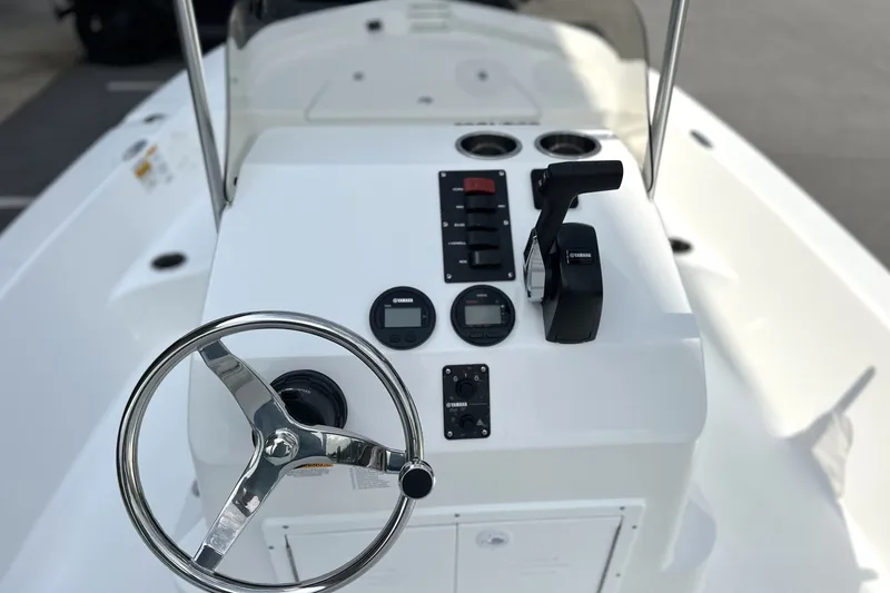 Slide: The Image of Steering console of a 2027 Frontier 180 boat with modern controls and gauges. - 7
