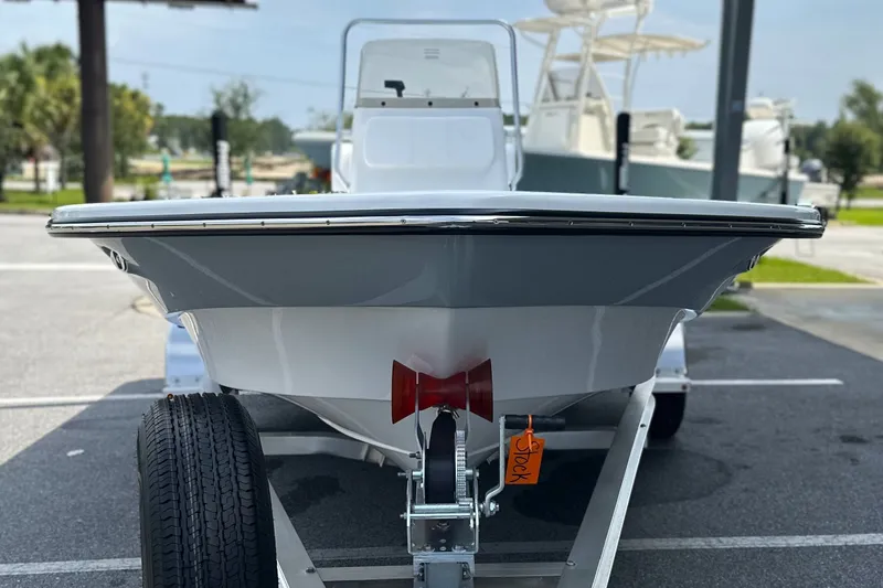 Slide: The Image of 2027 Frontier 180 boat on trailer in parking lot, front view. - 19