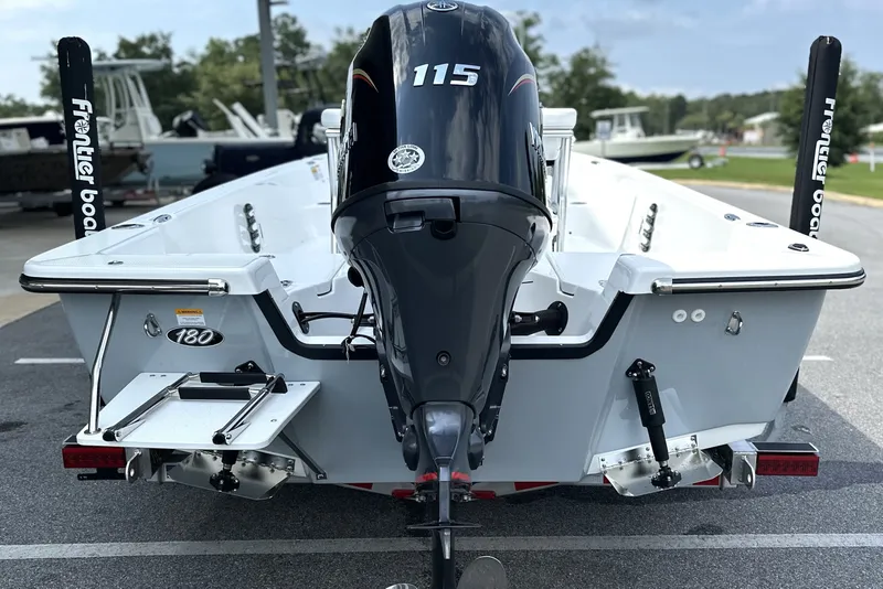 Slide: The Image of 2027 Frontier 180 boat with powerful 115 outboard motor, displayed outdoors. - 16