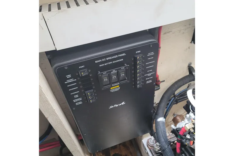 Slide: The Image of Main DC breaker panel on 2007 Sea Ray 340 boat, featuring battery solenoids and wiring. - 22