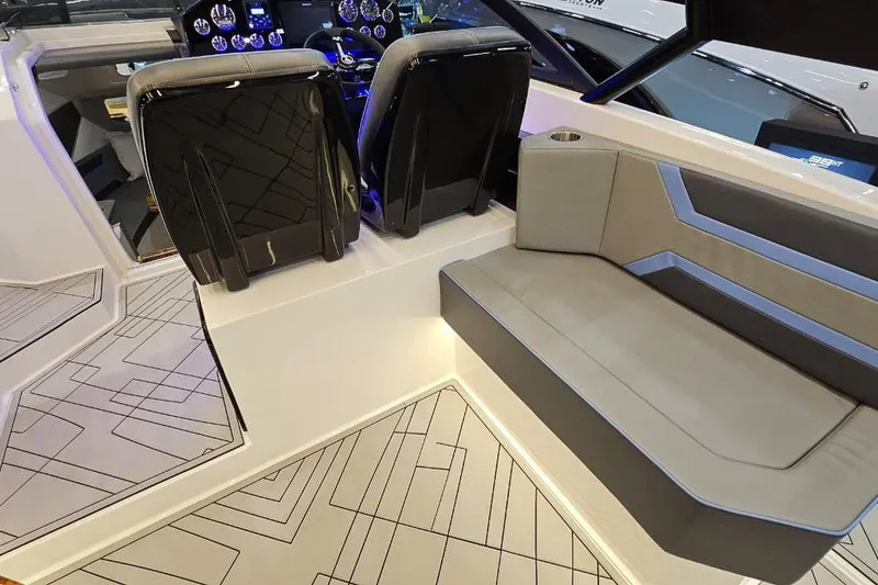 Slide: The Image of Interior of 2026 Hanover 327 boat with modern seating and dashboard design. - 6