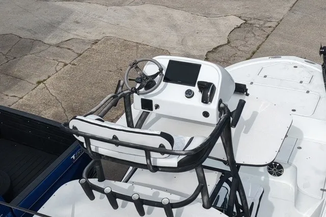 Slide: The Image of 2023 Canyon Bay 28h boat helm with steering wheel and controls. - 5