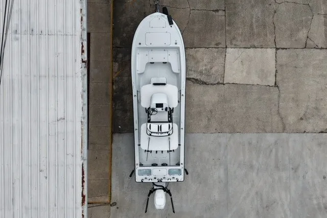 Slide: The Image of Aerial view of 2023 Canyon Bay 28h boat docked on concrete surface. - 8