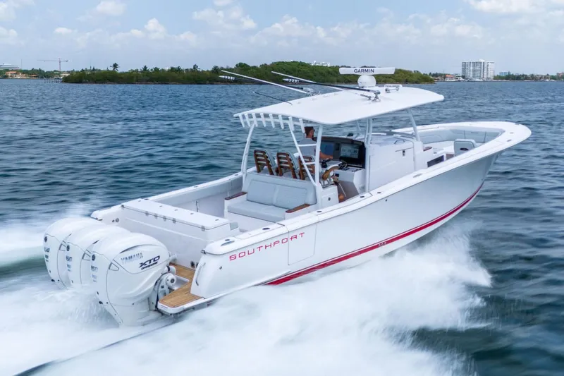Slide: The Image of Manufacturer Provided Image: 2026 Southport 38 FE boat cruising swiftly on the water. - 1