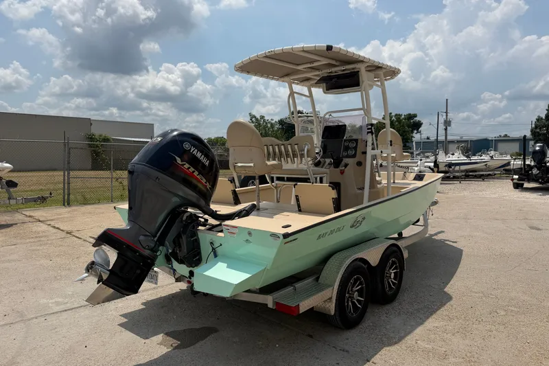 Slide: The Image of 2021 G3 Bay 20 DLX boat with Yamaha outboard motor on trailer, parked outdoors. - 4