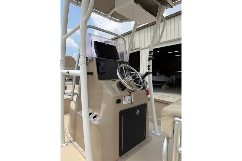 Slide: The Image of 2021 G3 Bay 20 DLX boat console with steering wheel and controls. - 14
