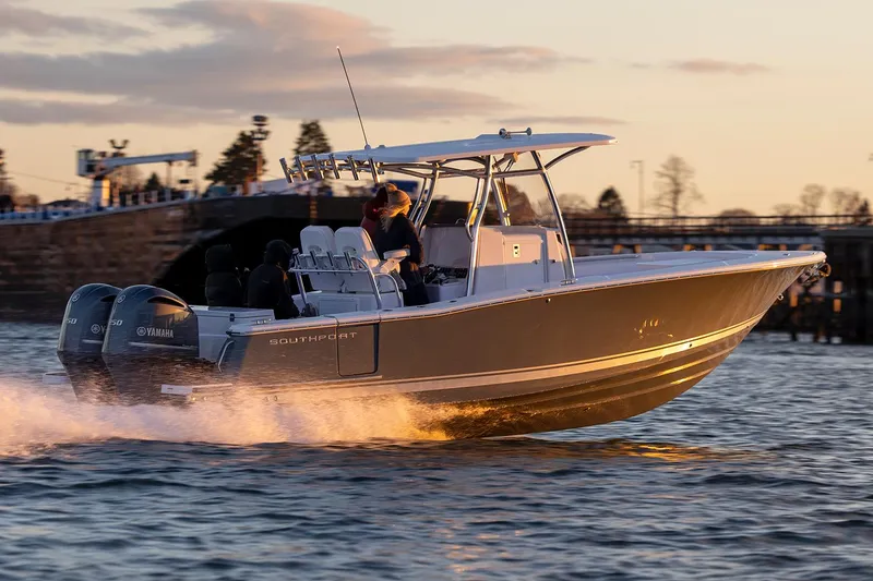 Slide: The Image of Manufacturer Provided Image: 2025 Southport 27 FE boat cruising at sunset with dual Yamaha engines. - 4