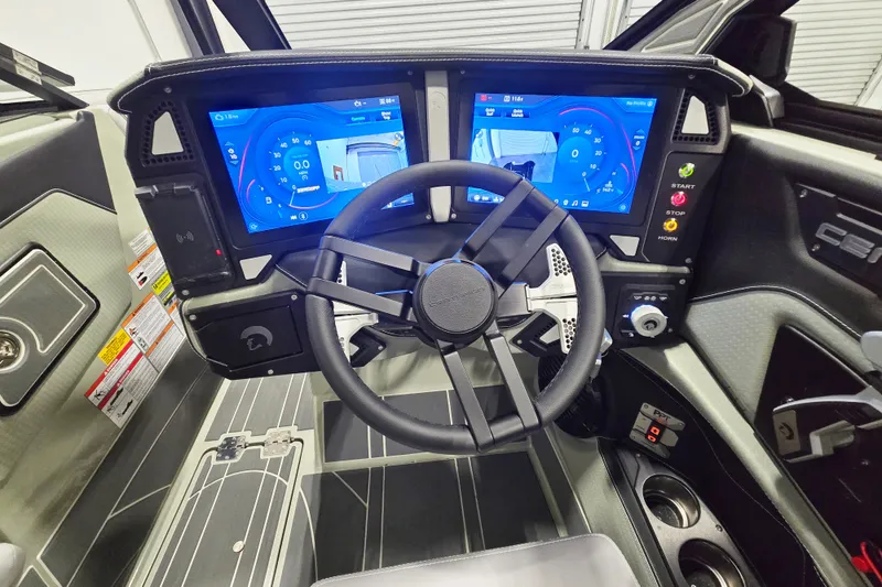 Slide: The Image of 2026 Centurion Ri230 dashboard with dual touchscreens and modern steering wheel design. - 8