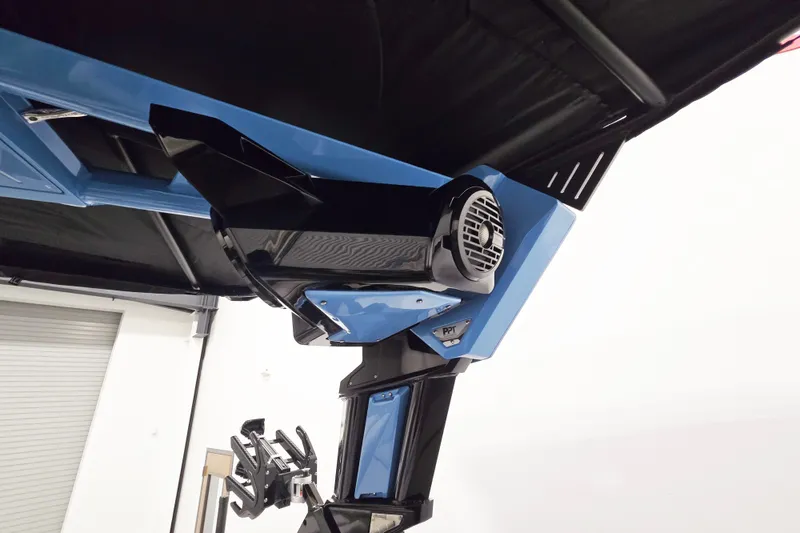 Slide: The Image of 2026 Centurion Ri230 boat with advanced speaker system and sleek design. - 13