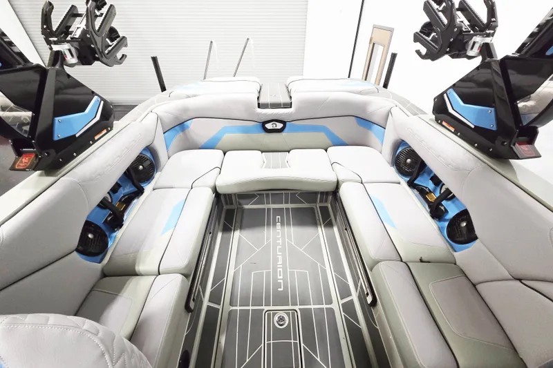 Slide: The Image of Interior of 2026 Centurion Ri230 boat with sleek seating and modern design. - 11