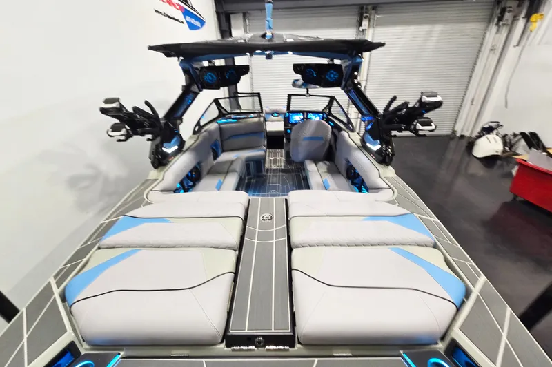 Slide: The Image of 2026 Centurion Ri230 boat interior with modern seating and advanced audio system. - 17