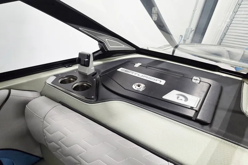 Slide: The Image of Interior of 2026 Centurion Ri230 boat with cup holders and sleek dashboard design. - 10