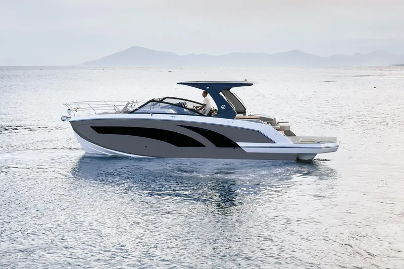Slide: The Image of 2026 Hanover 347 boat cruising on calm sea with distant mountains. - 1