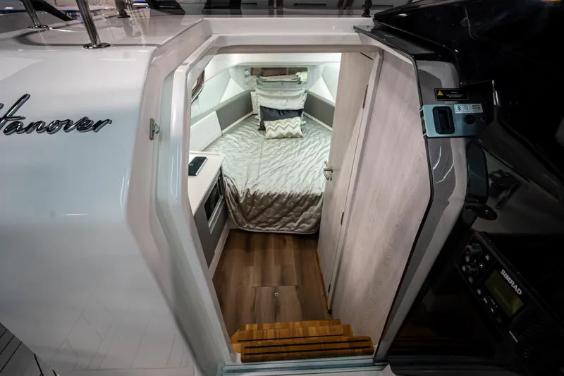 Slide: The Image of Interior cabin of 2026 Hanover 347 boat with cozy bed and modern design. - 11