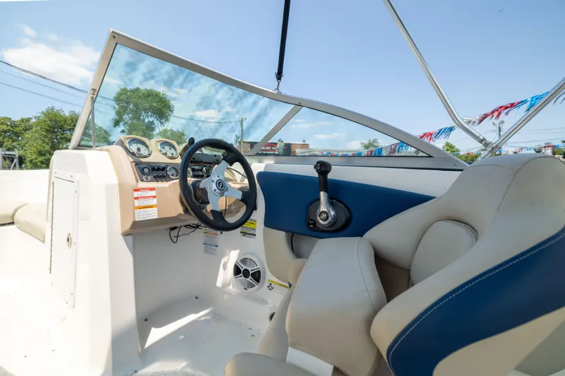 Slide: The Image of 2014 Chaparral 18 H2O Ski & Fish boat interior with steering wheel and dashboard controls. - 10