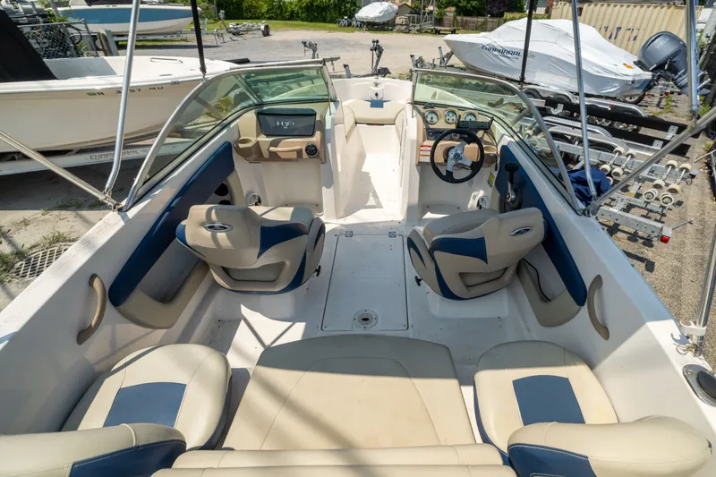 Slide: The Image of 2014 Chaparral 18 H2O Ski & Fish boat interior with seating and steering wheel. - 6