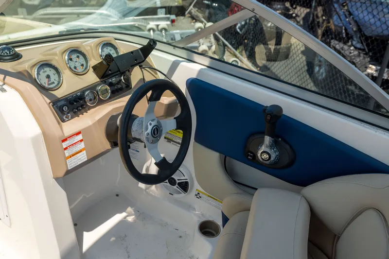 Slide: The Image of Interior view of 2014 Chaparral 18 H2O Ski & Fish boat dashboard and steering wheel. - 13