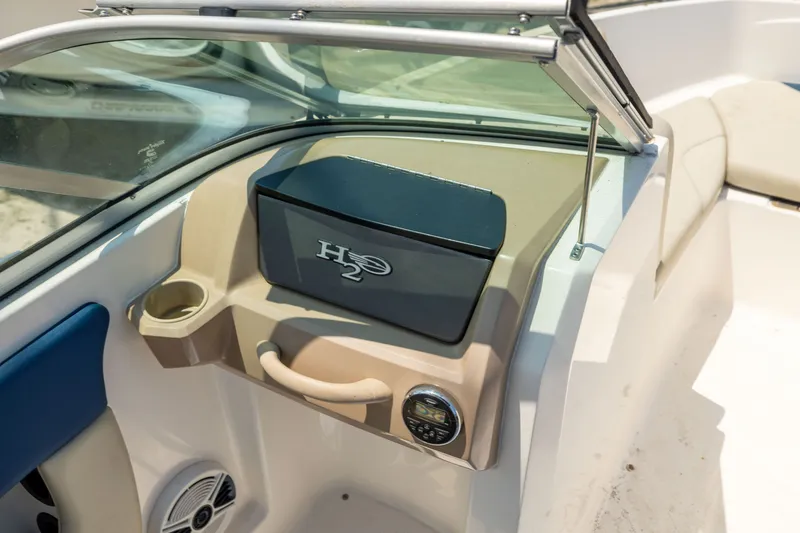Slide: The Image of 2014 Chaparral 18 H2O Ski & Fish boat interior with dashboard and storage compartment. - 12