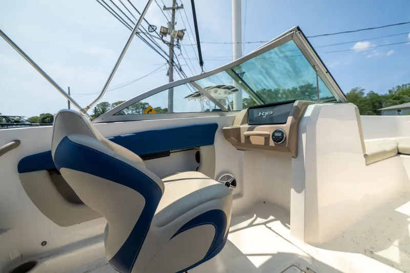Slide: The Image of 2014 Chaparral 18 H2O Ski & Fish boat interior with blue and beige seating. - 11