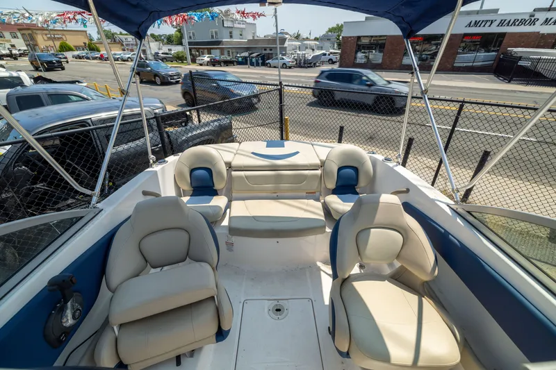 Slide: The Image of 2014 Chaparral 18 H2O Ski & Fish boat interior with seating and canopy. - 8