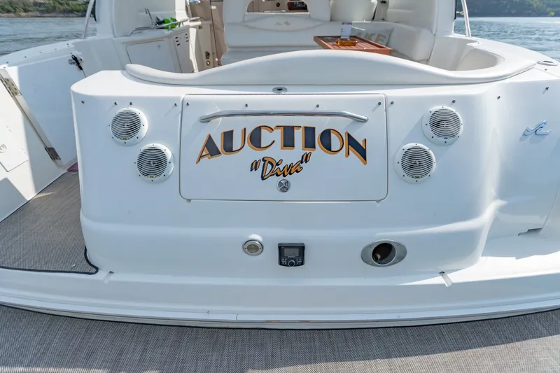 Slide: The Image of Rear view of 2000 Sea Ray 410 Sundancer yacht with custom nameplate "Auction Diva." - 19