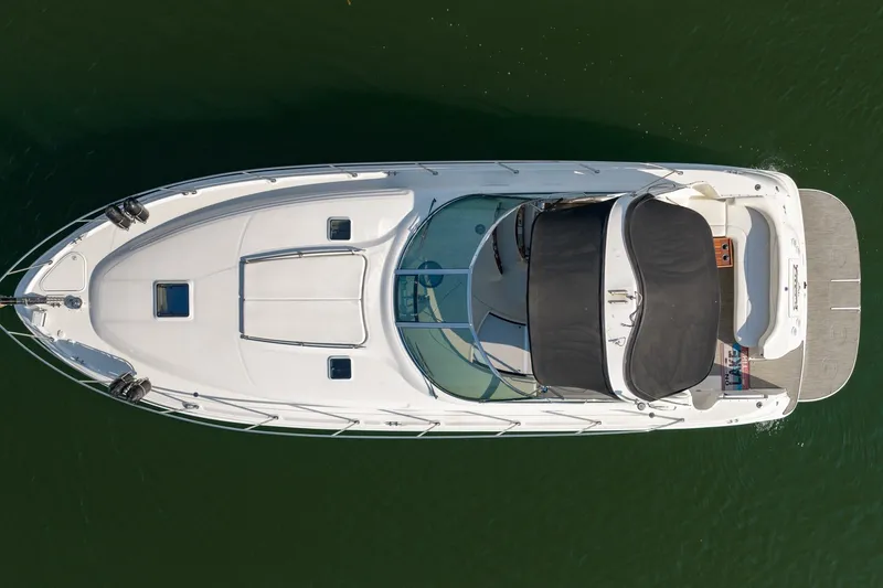 Slide: The Image of Top view of a 2000 Sea Ray 410 Sundancer yacht on water. - 11