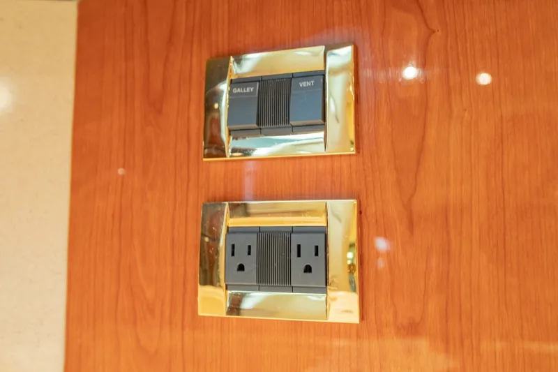 Slide: The Image of Electrical switches and outlet on Sea Ray 410 Sundancer yacht, 2000 model. - 51