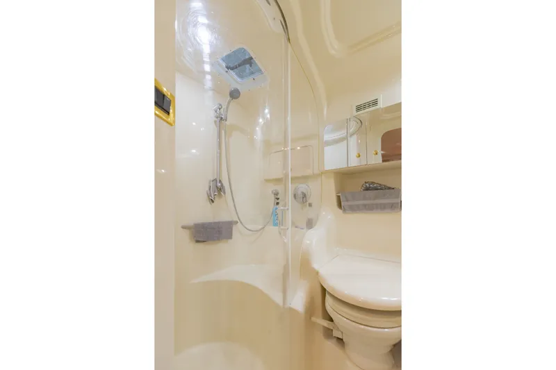 Slide: The Image of Bathroom interior of 2000 Sea Ray 410 Sundancer yacht, featuring shower and toilet. - 55