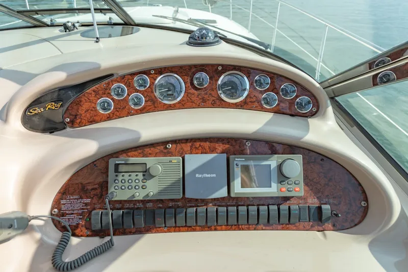 Slide: The Image of Control panel of a 2000 Sea Ray 410 Sundancer yacht with navigation instruments. - 26