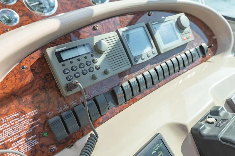 Slide: The Image of Control panel of a 2000 Sea Ray 410 Sundancer boat with navigation equipment. - 29