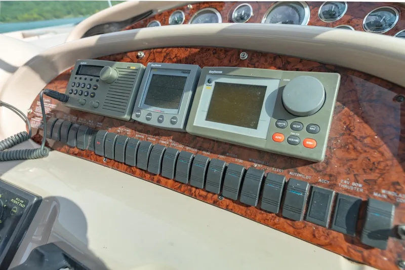 Slide: The Image of Control panel of a 2000 Sea Ray 410 Sundancer boat with navigation instruments. - 30