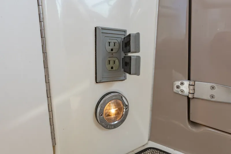 Slide: The Image of Electrical outlet and light on 2000 Sea Ray 410 Sundancer boat interior. - 24