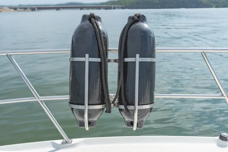 Slide: The Image of Two black boat fenders on a 2000 Sea Ray 410 Sundancer railing. - 42