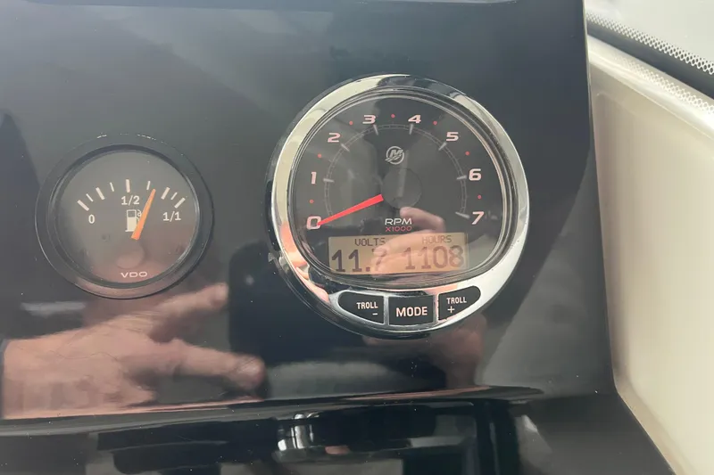 Slide: The Image of Dashboard of 2022 Jeanneau NC Weekender 695 Series 2 showing fuel and RPM gauges. - 10