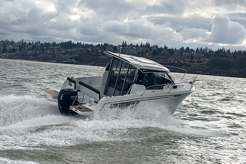 The Image of 2022 Jeanneau NC Weekender 695 Series 2 on choppy waters. - 0