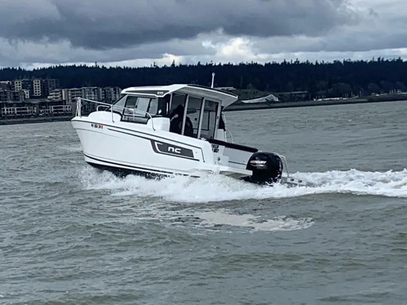 Slide: The Image of Jeanneau NC Weekender 695 Series 2 boat on water, 2022 model. - 1