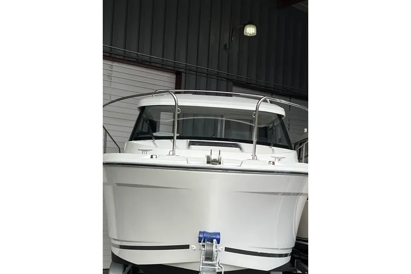 Slide: The Image of 2022 Jeanneau NC Weekender 695 Series 2 boat in a storage facility. - 12
