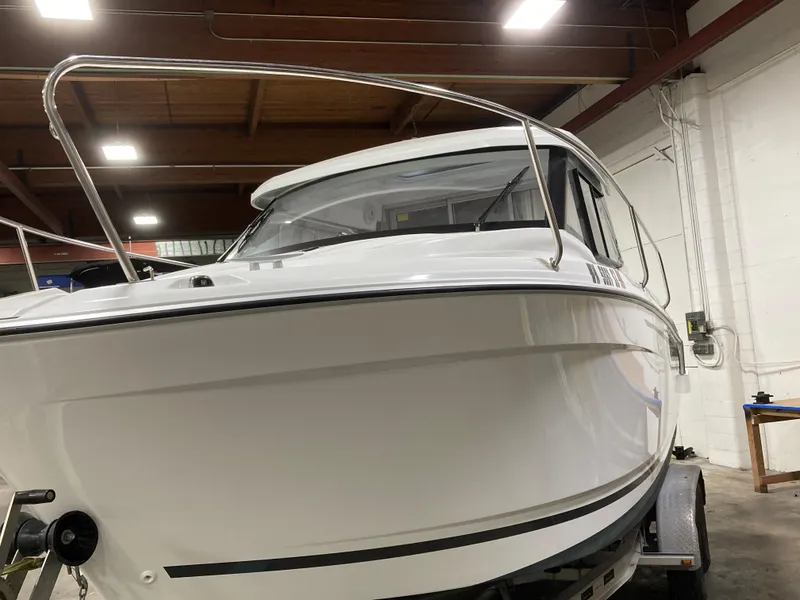 Slide: The Image of Jeanneau NC Weekender 695 Series 2, 2022, in a storage facility. - 4