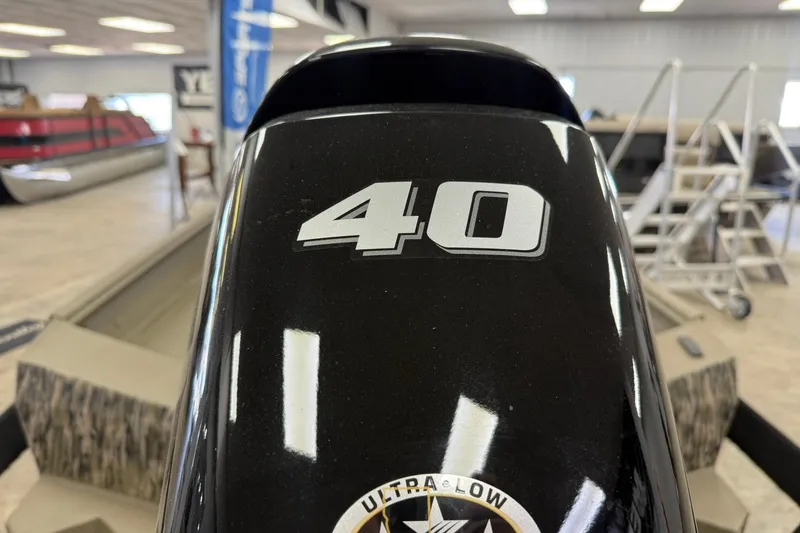 Slide: The Image of Outboard motor with "40" label, Thor 1754 Thunder Hammer, 2027 model, in showroom. - 16