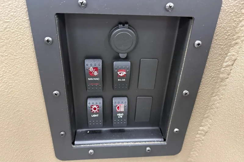 Slide: The Image of Control panel with switches for navigation, bilge, light, and head lights on Thor 1754 Thunder Hammer. - 10