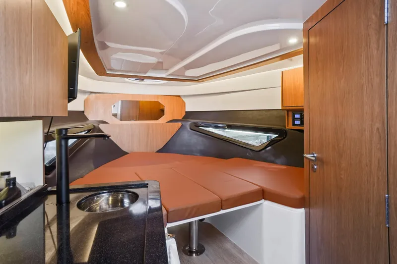Slide: The Image of Interior of 2026 Hanover 355 boat with modern design and cozy sleeping area. - 2
