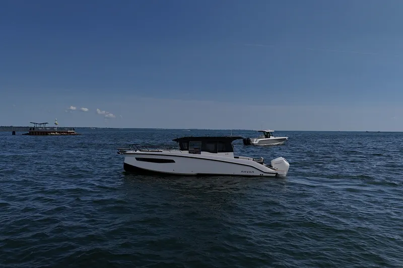 The Image of 2026 Navan C30 boat on calm sea under clear blue sky. - 1